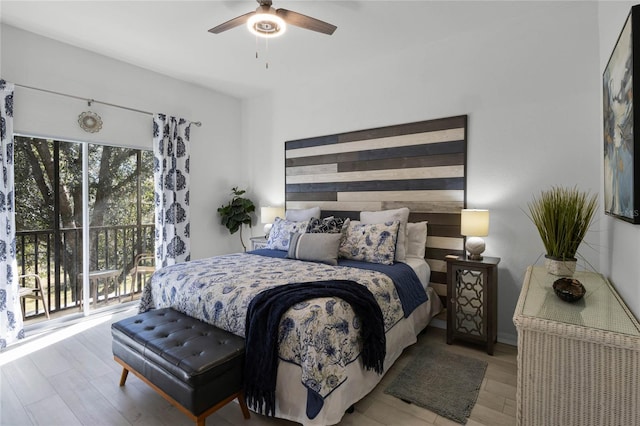 bedroom featuring access to exterior, light hardwood / wood-style flooring, and ceiling fan