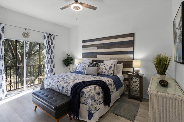 411 Lucaya Loop Unit 411, Davenport, FL 33897 - bedroom featuring wood finished floors, access to exterior, and ceiling fan