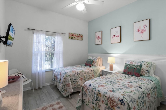 bedroom with ceiling fan and light hardwood / wood-style flooring