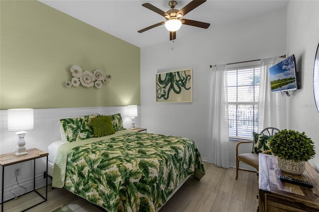 bedroom with hardwood / wood-style floors and ceiling fan