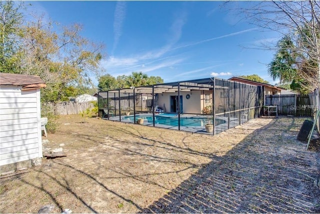 view of swimming pool with glass enclosure