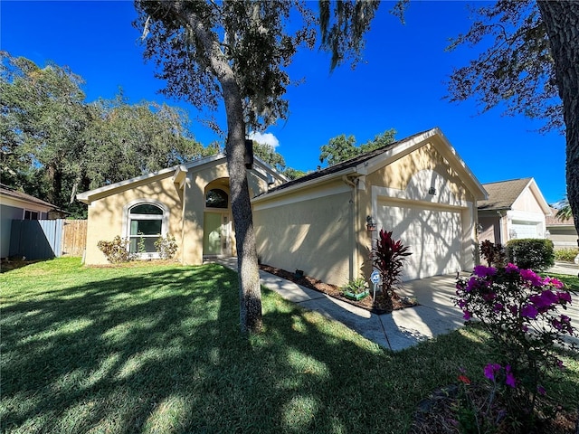 ranch-style house with a front lawn and a garage