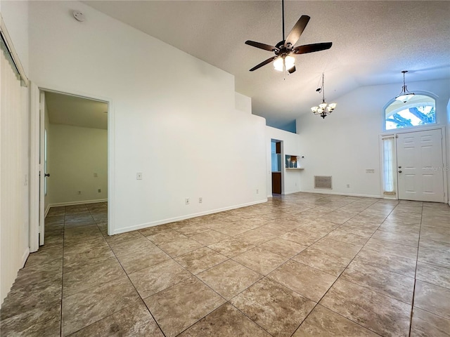 unfurnished living room featuring ceiling fan with notable chandelier, tile patterned flooring, high vaulted ceiling, and a textured ceiling