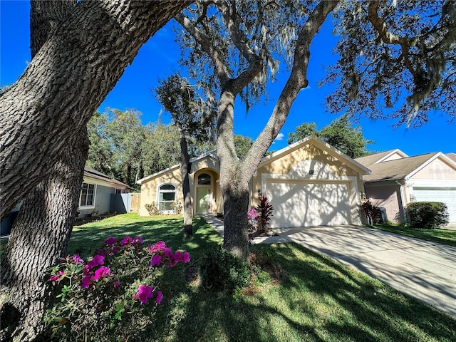 view of front facade with a front yard and a garage