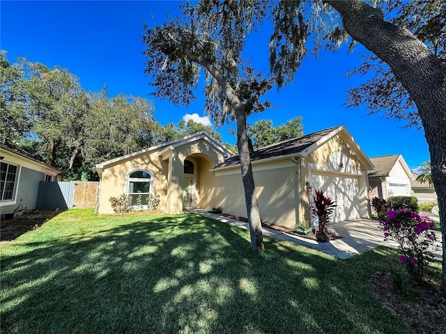 single story home with a garage and a front lawn