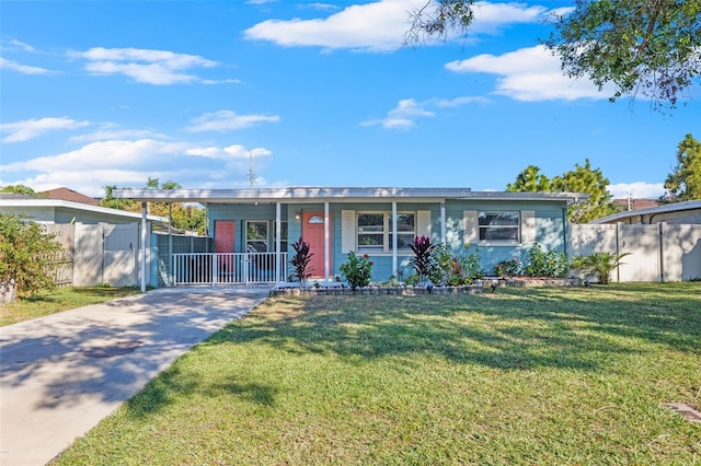 ranch-style home with a front lawn and a carport