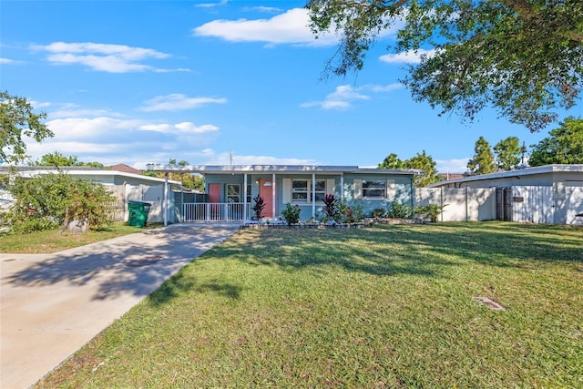 ranch-style home with a front lawn