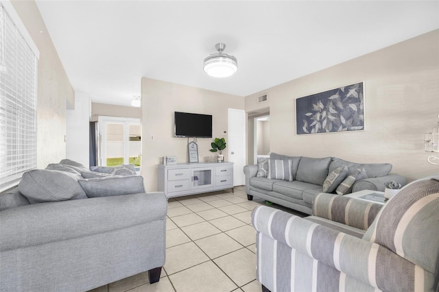 living room with light tile patterned floors