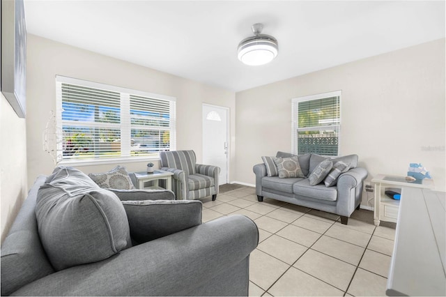 living room with light tile patterned flooring and a healthy amount of sunlight