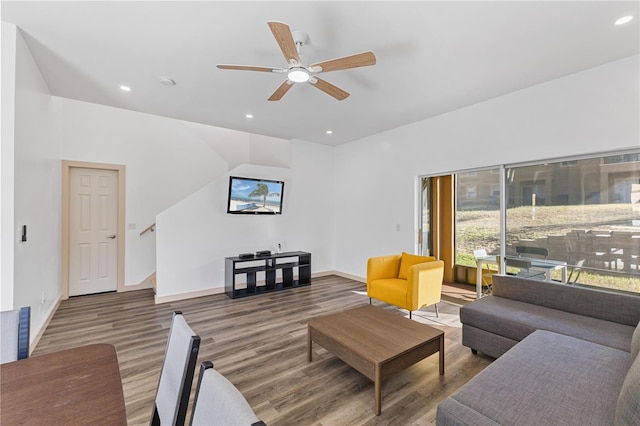 living room with hardwood / wood-style floors and ceiling fan