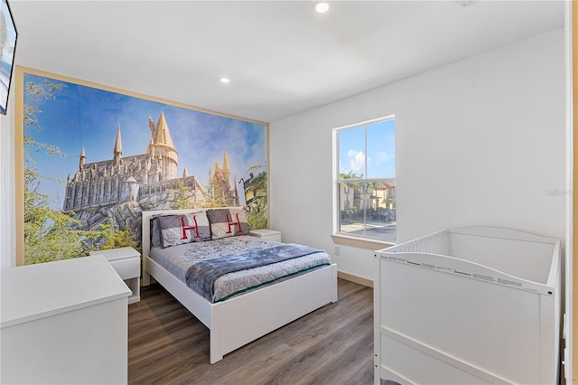 bedroom featuring dark hardwood / wood-style flooring