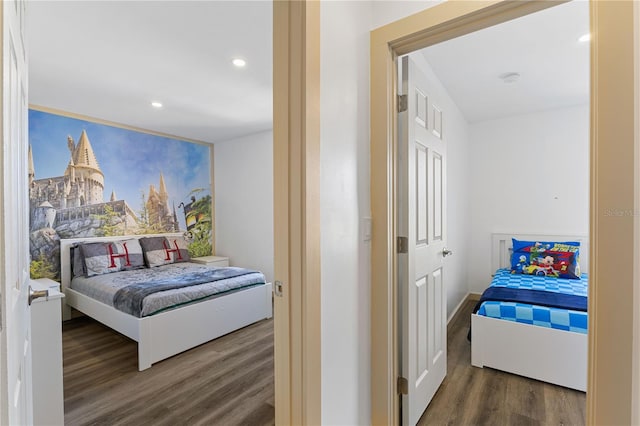 bedroom featuring dark wood-type flooring and recessed lighting