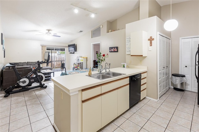 kitchen with dishwasher, sink, hanging light fixtures, vaulted ceiling, and kitchen peninsula