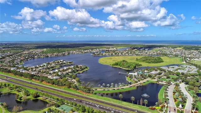 birds eye view of property with a water view