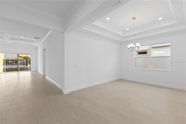 unfurnished room with a tray ceiling, crown molding, and a chandelier