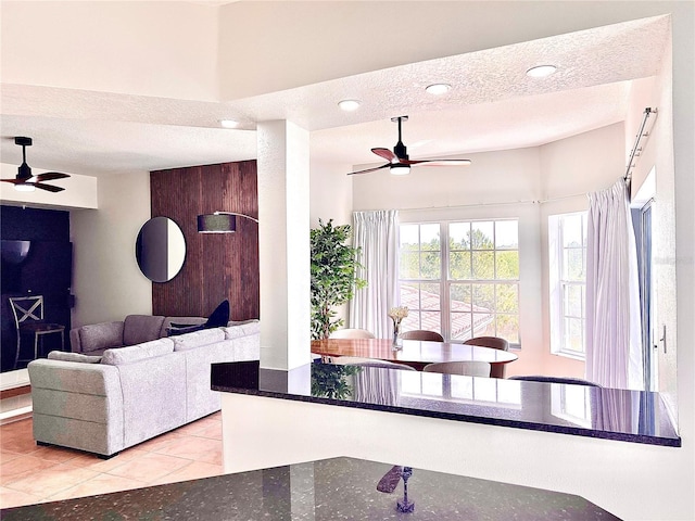 tiled living room with a textured ceiling