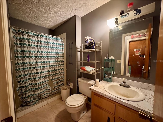 bathroom featuring a shower with curtain, tile patterned floors, a textured ceiling, toilet, and vanity