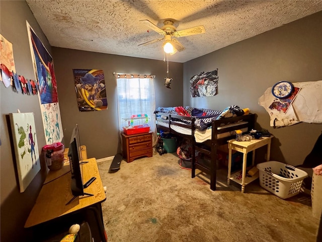 carpeted bedroom with a textured ceiling and ceiling fan