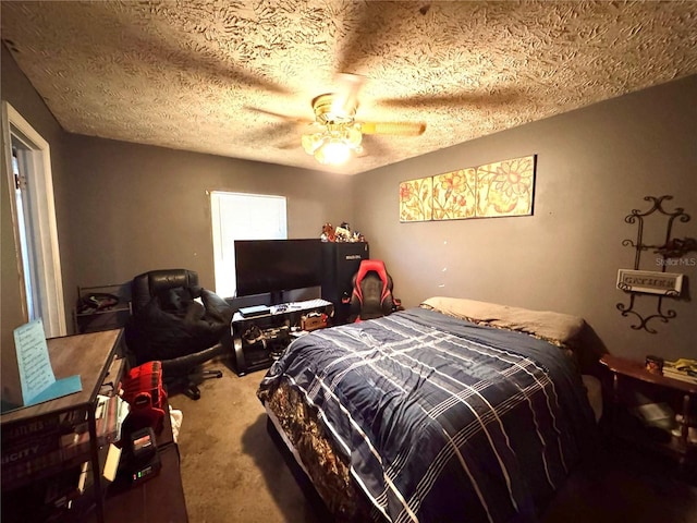 carpeted bedroom featuring a textured ceiling and ceiling fan