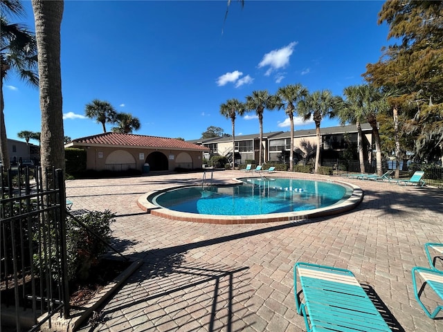 view of swimming pool with a patio