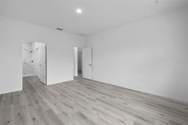 unfurnished room featuring light wood-type flooring