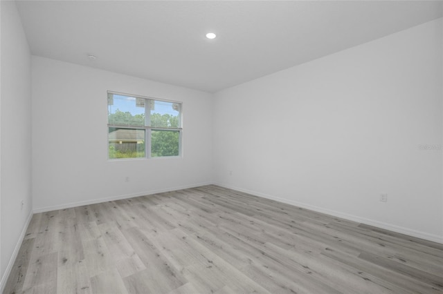 unfurnished room featuring light hardwood / wood-style flooring