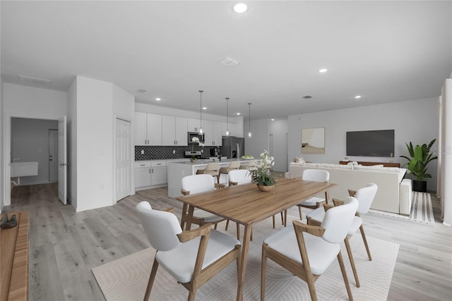 dining room featuring light hardwood / wood-style floors