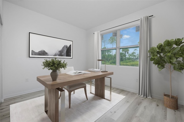 office area with light hardwood / wood-style floors