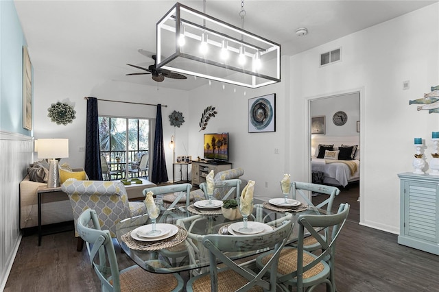 dining area featuring ceiling fan and dark wood-type flooring