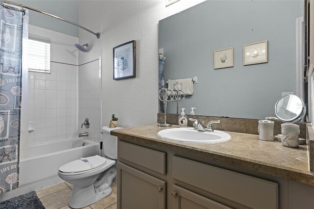 608 Gran Bahama Blvd Unit 608, Davenport, FL 33897 - bathroom with vanity, tile patterned flooring, shower / bath combo with shower curtain, toilet, and a textured wall