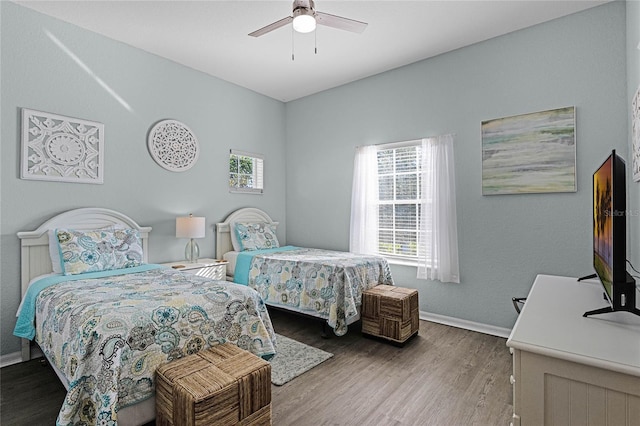 bedroom with hardwood / wood-style flooring and ceiling fan