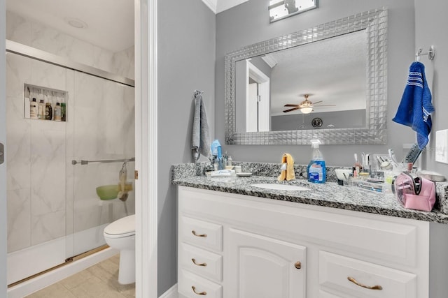 bathroom featuring toilet, walk in shower, tile patterned flooring, ceiling fan, and vanity