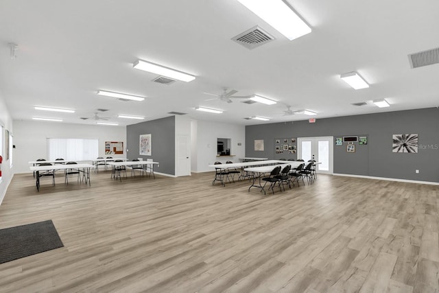 dining space featuring light wood-type flooring and ceiling fan