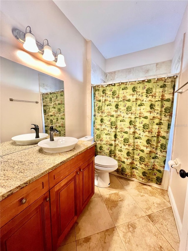 bathroom with a shower with curtain, vanity, and toilet