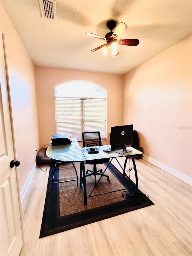 office area with ceiling fan and light wood-type flooring