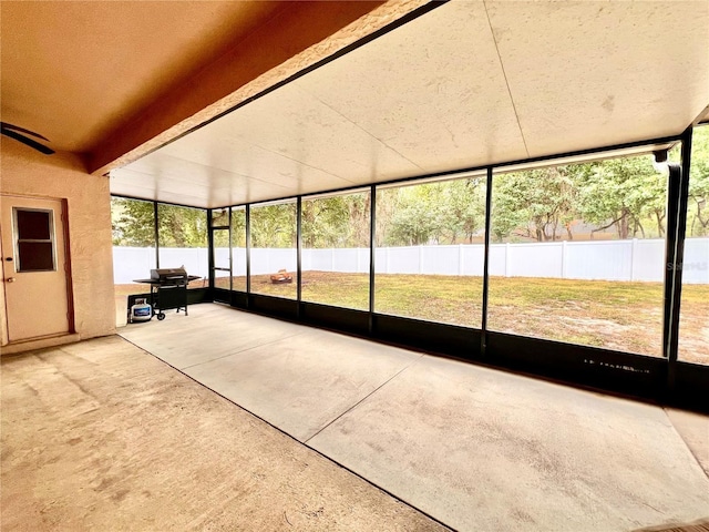 unfurnished sunroom featuring plenty of natural light