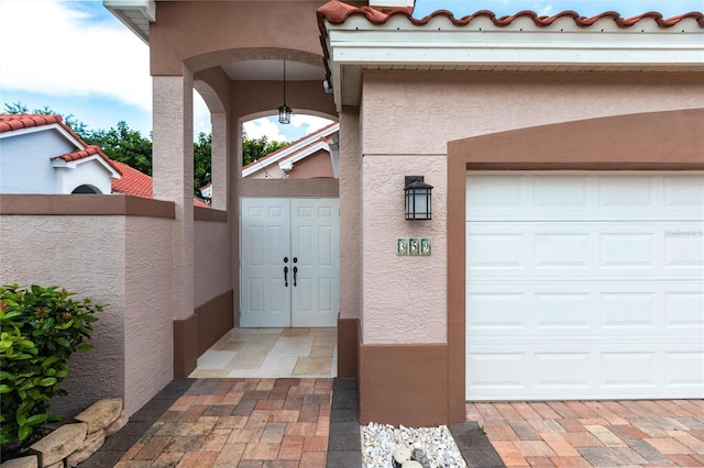 entrance to property featuring a garage