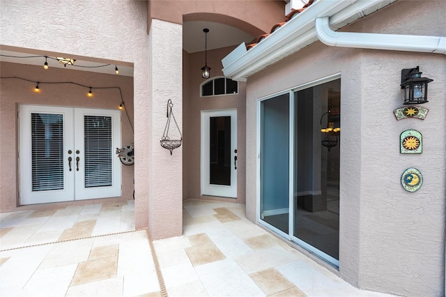 doorway to property with a patio area and french doors