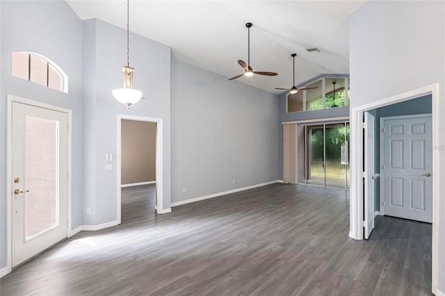 interior space with ceiling fan, high vaulted ceiling, a healthy amount of sunlight, and dark hardwood / wood-style floors