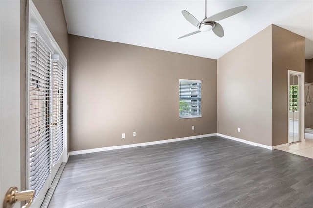 unfurnished bedroom with hardwood / wood-style floors, ceiling fan, and lofted ceiling