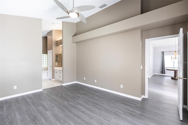 interior space with ceiling fan and dark wood-type flooring