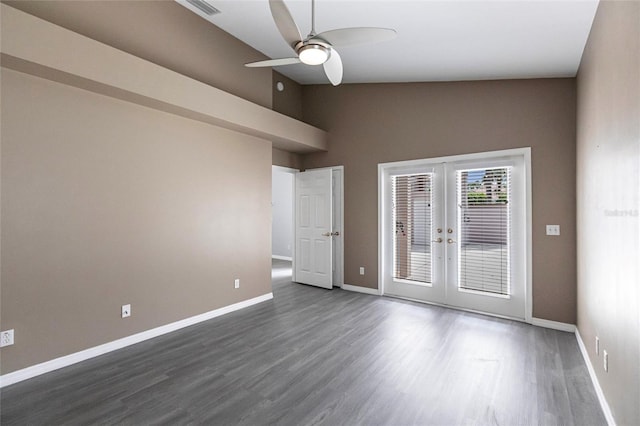 spare room featuring french doors, dark hardwood / wood-style floors, high vaulted ceiling, and ceiling fan