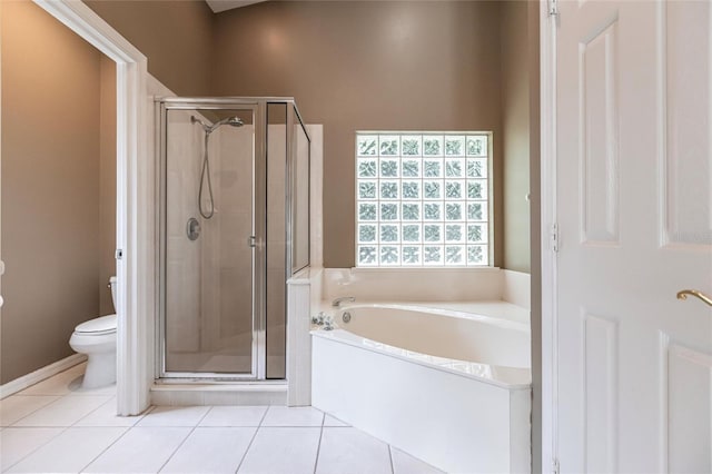 bathroom with tile patterned floors, toilet, and independent shower and bath