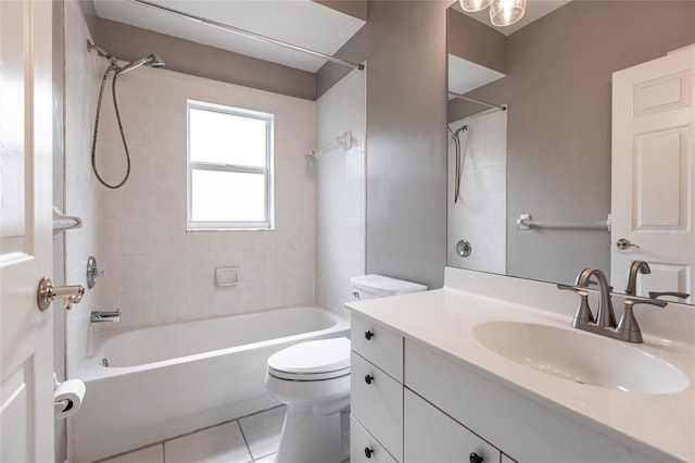 full bathroom with tile patterned floors, vanity, toilet, and tiled shower / bath combo