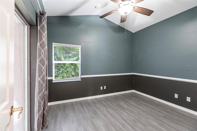 unfurnished room with hardwood / wood-style floors, ceiling fan, and lofted ceiling