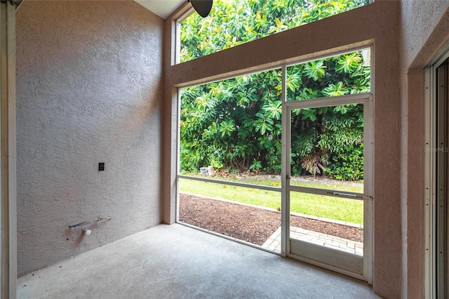 interior space featuring concrete floors and a wealth of natural light