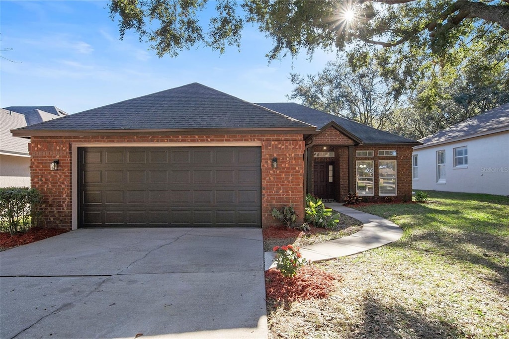 ranch-style house featuring a garage