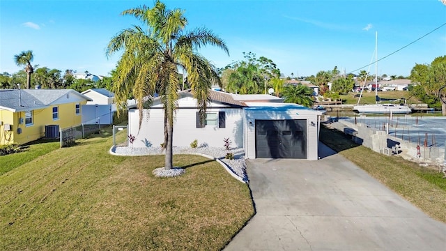 4059 Orient Dr, Hernando Beach, FL 34607 - view of front of house with a garage, cooling unit, concrete driveway, and a residential view