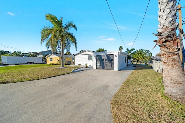 4059 Orient Dr, Hernando Beach, FL 34607 - view of front of property featuring concrete driveway and a front yard