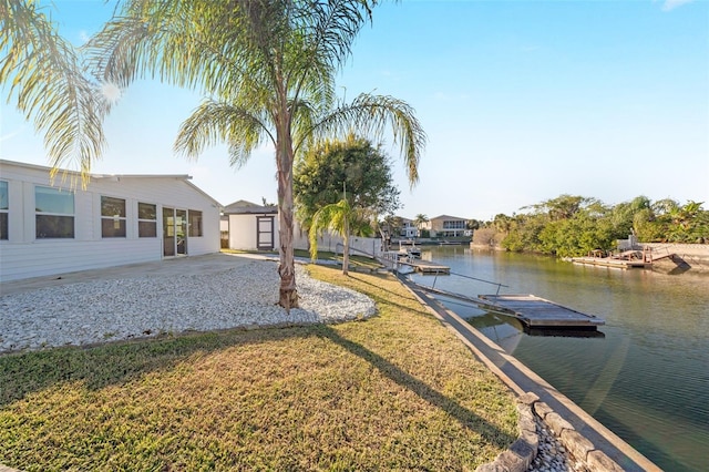 4059 Orient Dr, Hernando Beach, FL 34607 - dock featuring a water view and a lawn